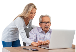 woman helping an older man at the computer